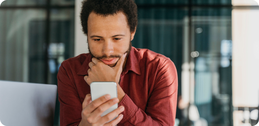 An entrepreneur is checking his phone.